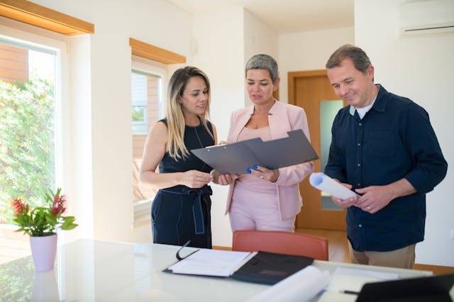 real estate agent speaking with clients