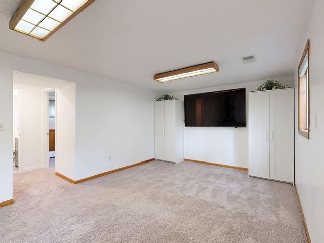 empty room with tv on the wall