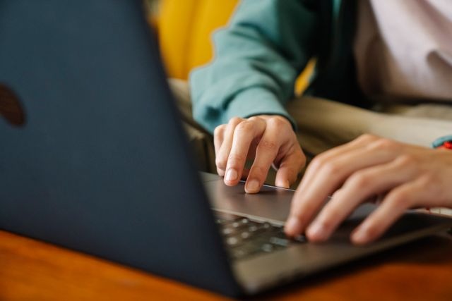 person typing on a laptop