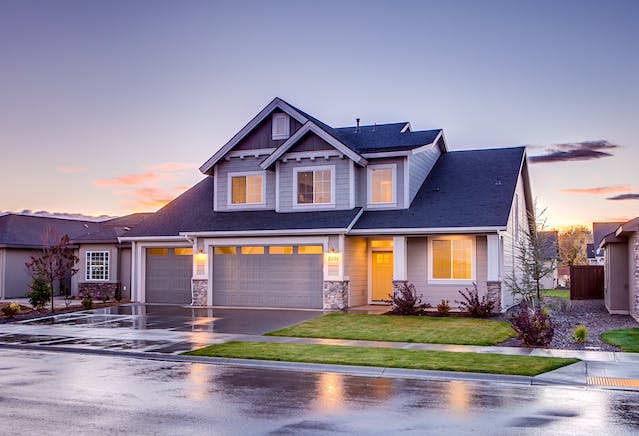 a blue a grey two story single family home