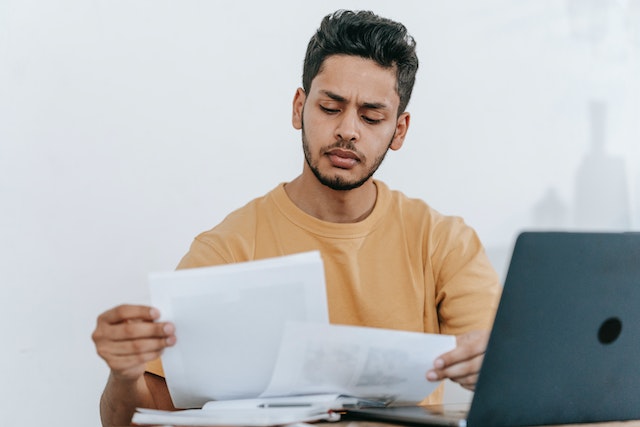 a property manager reviewing a tenant application at their desk