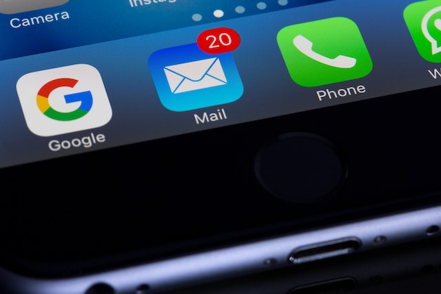 close-up of a phone screen showing there are twenty unread emails