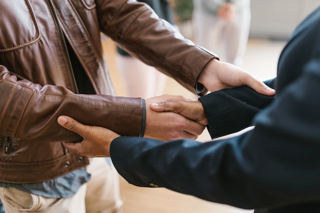 close up of two people shaking hands