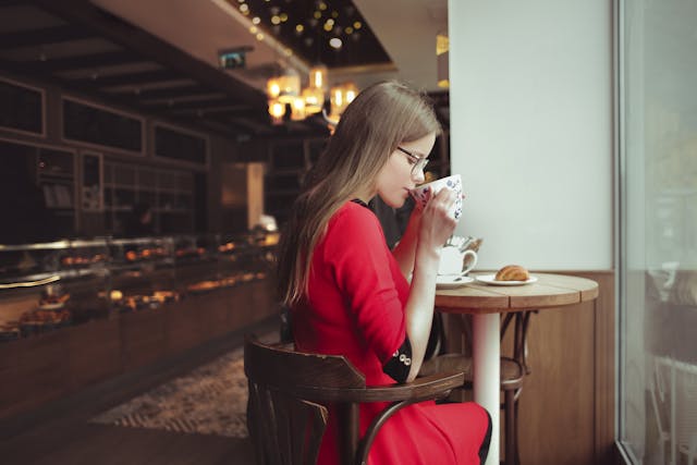 person drinking coffe at a coffee shop