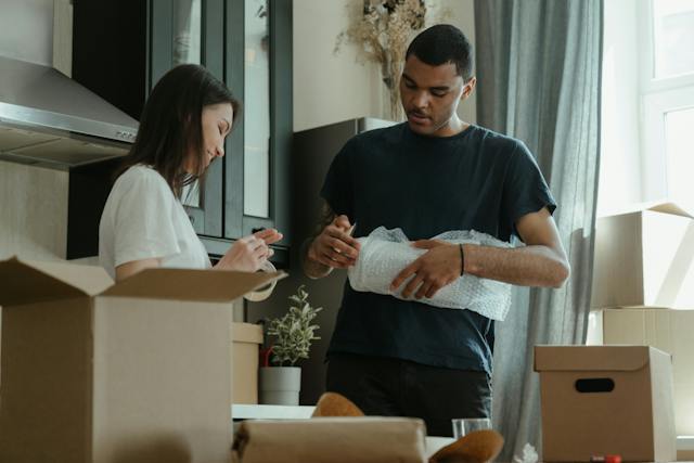 two tenants unpacking their moving boxes