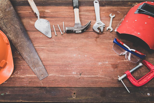 various tools sitting on a wooden table